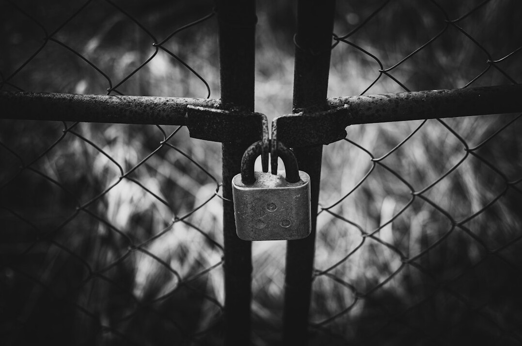 Close-up of a padlock icon over a digital screen symbolizing data security